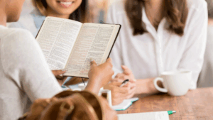 women in Bible study, growing together to become women of noble character
