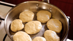 sourdough drop scones browning on the underside.