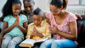 a family praying together