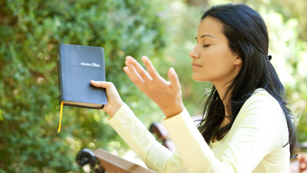 a woman praying the Word of God