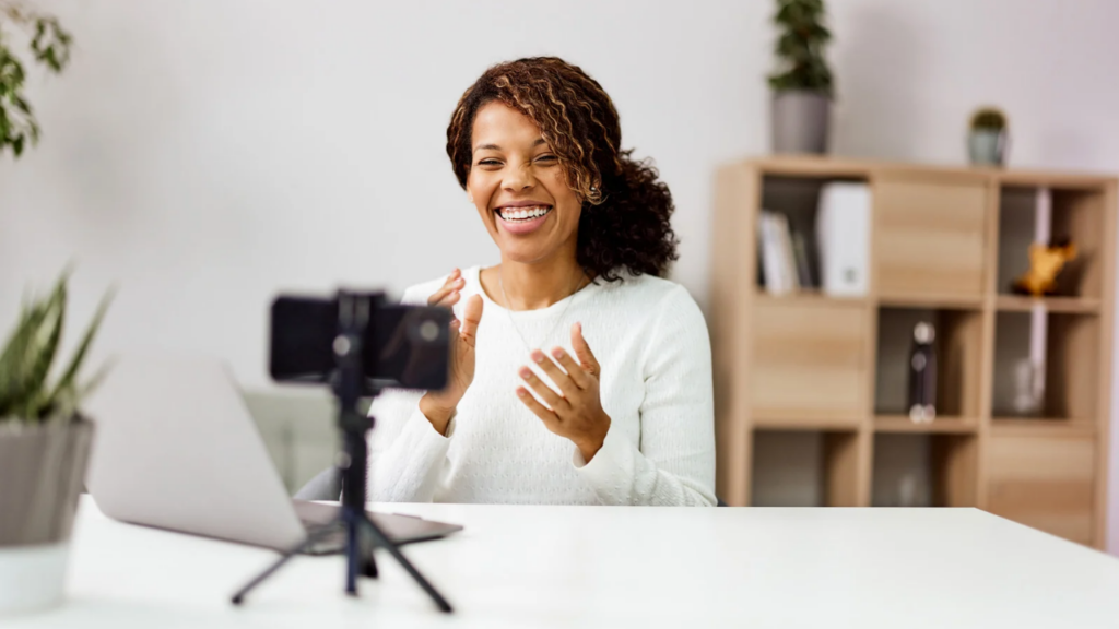 a woman recording a video on their Christian YouTube channel idea