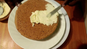 frosting cake using no-mixer coconut cream cheese frosting