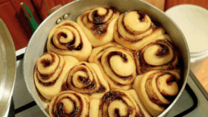 Stovetop Sourdough Cinnamon Rolls ready and firm on the surface.