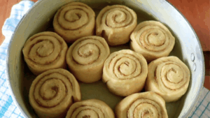 The slightly puffed up proofed raw cardamom rolls