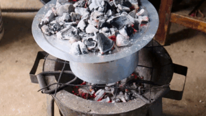 baking without an oven with very few hot coals at the bottom and most of the calls on the top lid.