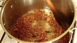 The onion, garlic, and ginger mixer that has turned a deep golden brown.