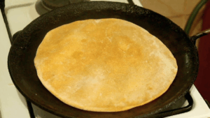 Our pumpkin chapati starting to form airy bubbles as you start cooking it.