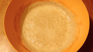Foamy, well-fermented sourdough pancake batter after bulk ferment, ready for cooking.