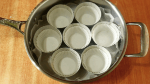 muffin tins lined with liners ready for baking muffins without an oven.