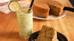 enjoying no oven zucchini cake with a glass of refreshing lemon rind drink